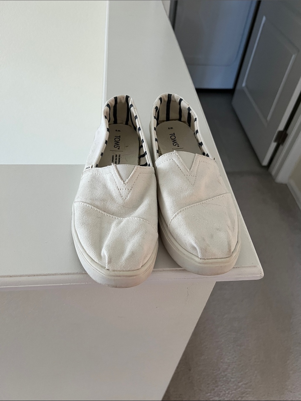 Toms Kids Slip-On Sneakers in White with Navy Stripe Lining